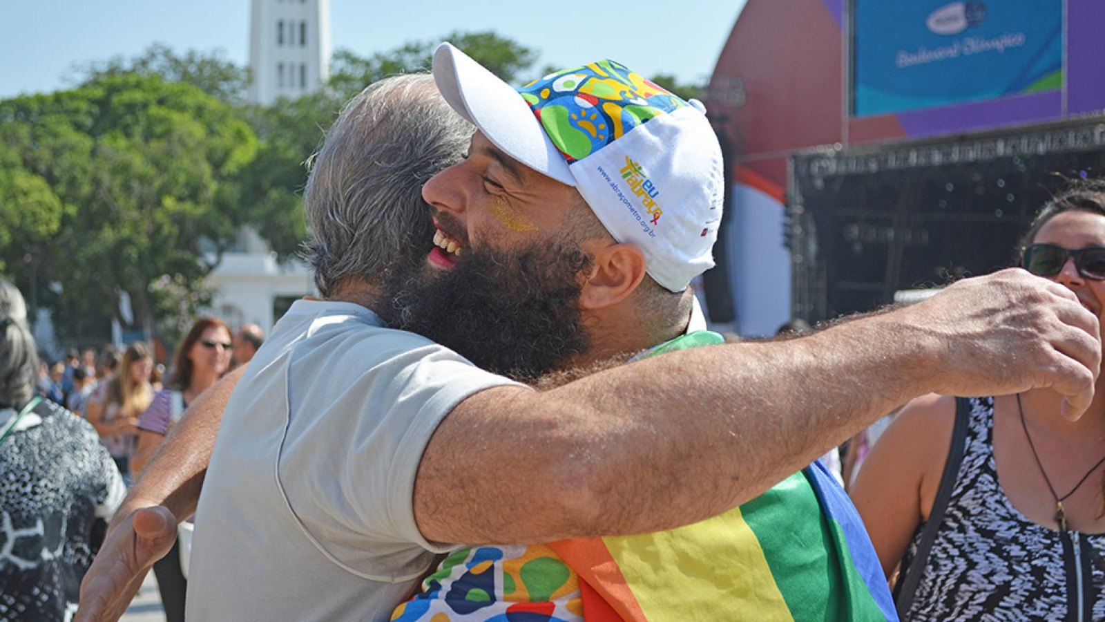 Two people hugging at the Olympic Boulevard in Rio during the #IEmbrace campaign