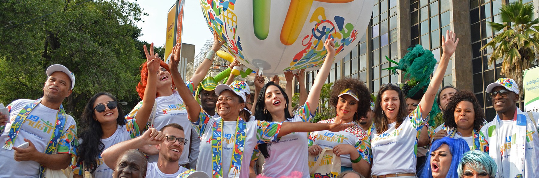 Volunteers and drag queens celebrating under the giant #IEmbrace balloon in Rio de Janeiro