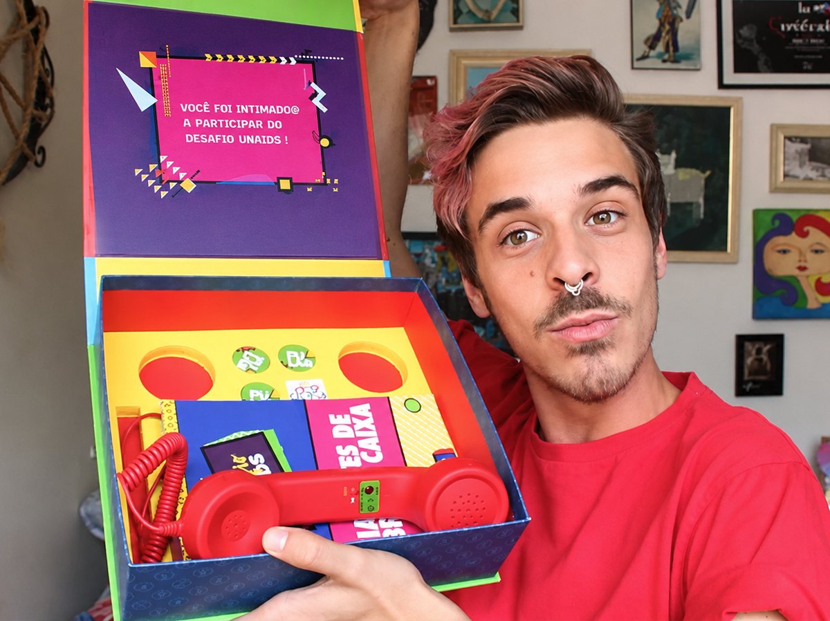 A creator opening the box on camera