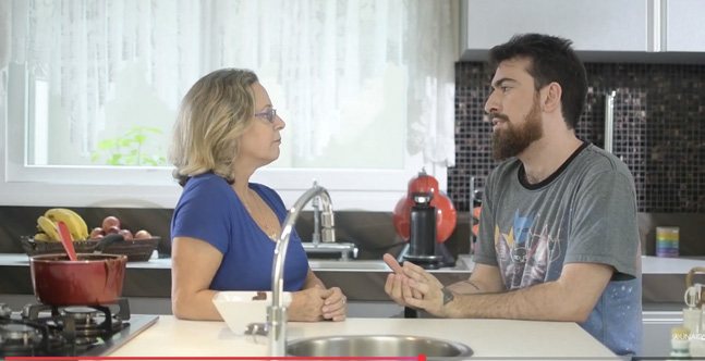 Two participants talking in a kitchen